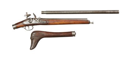 null BRACONNIER RIFLE, the barrel in damask and the stock carved in the head of a...
