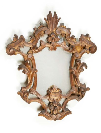 null MIRROR REFLECTOR with mercury and carved and gilded wood; to the cushion a radiance...