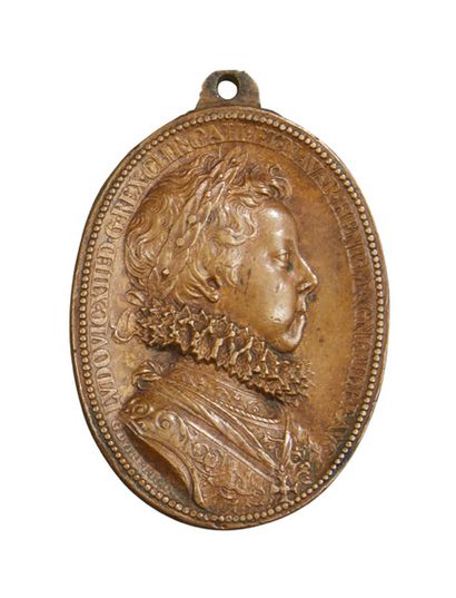 null Oval bronze medal representing Louis XIII in profile; the reverse side shows...