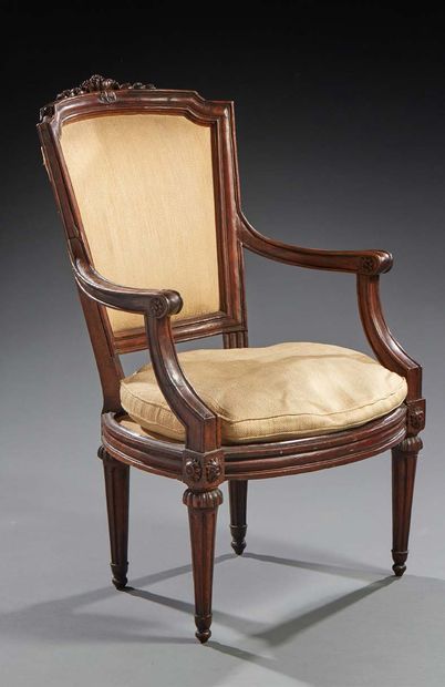 null Walnut moulded and carved armchair with decorations; modillions with flutes;...