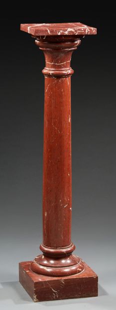 A red veined marble SELLET in the form of...