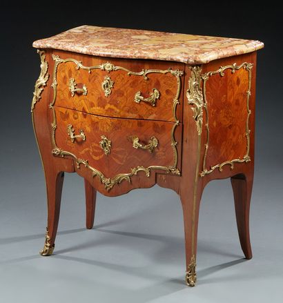 null COMMODE inlaid with flowering and foliage branches on rosewood frieze backgrounds...