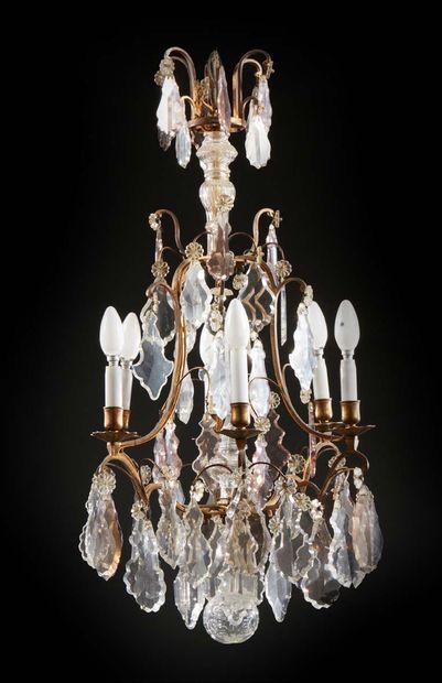 null A SIX LIGHTS CAGE LIGHT in gilt bronze decorated with moulded and cut crystals...