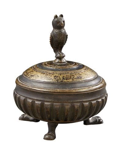null Box in chased and patinated bronze; of circular form, the catch in owl; the...
