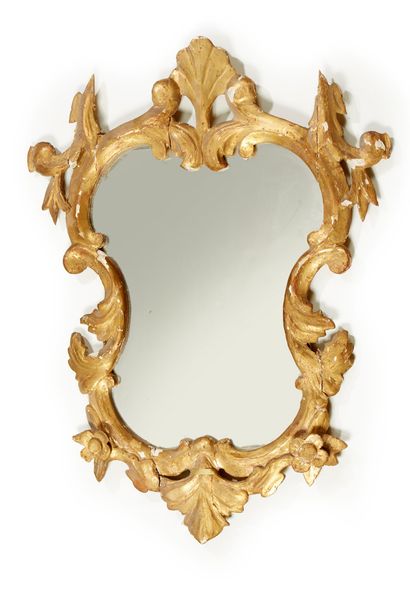 null SILVER MIRROR in a carved wooden frame decorated with foliage and stylized flowers.
Southern...