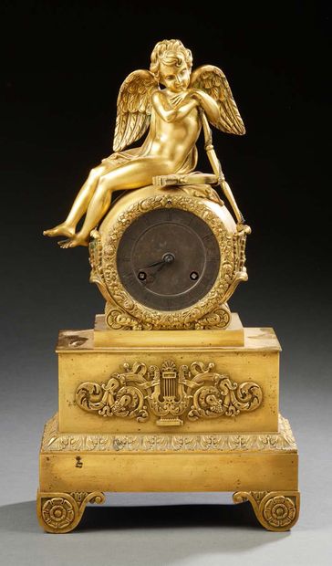 null A chased and gilded bronze CLOCK; the damping decorated with Cupid resting;...