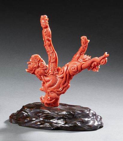 CHINE Carved orange coral group representing a dragon perched on a tree stump framed...