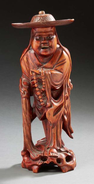 JAPON Carved root figurine representing Shoulao, eyes and teeth in bone First half...
