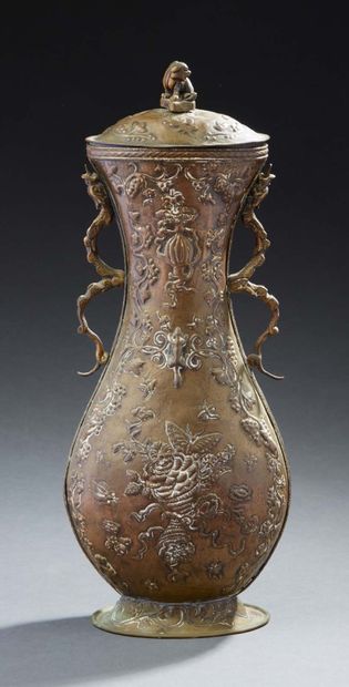CHINE Brass covered vase with repoussé decoration of flowers, fruits and butterflies,...