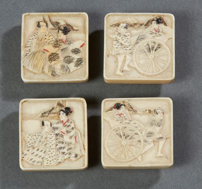 JAPON Set of four square ivory buttons carved with various motifs in light relief...