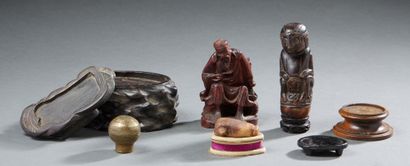 ASIE Lot composed of five wooden bases, a steatite hand, a carved wooden figurine...