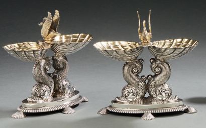 null PAIR OF LARGE SILVER AND GOLDEN SALT TANKS, the oval base resting on four feet...