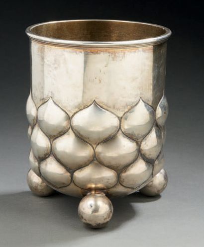 null Silver POT resting on three ball feet, the body decorated with cupules.
Germany...