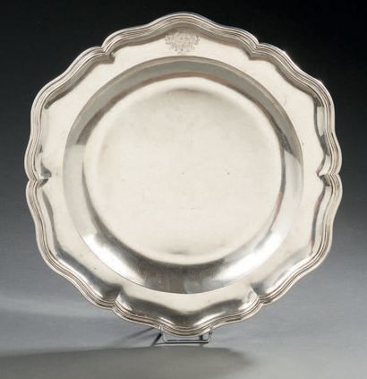 null A plain silver round dish, the rim moulded with fillets and contours, the wing...