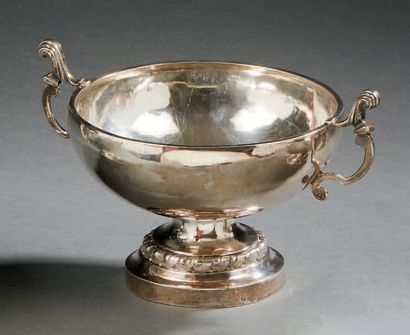 null A silver WEDDING CUP. It rests on a circular pedestal moulded with a frieze...