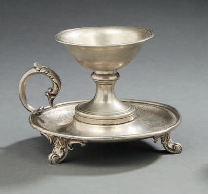 null A silver HANDKERCHIEF with arabesques. It stands on three scrolled feet.
Foreign...