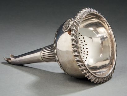 null A silver WINE SPOON with gadroon decoration, the clasp in the shape of a shell....