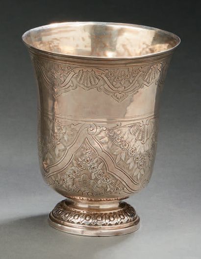 null A silver tulip-shaped TIMBALE, resting on a pedestal decorated with a frieze...
