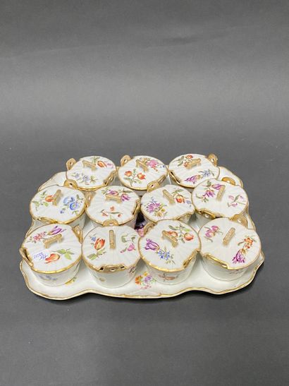 null Set of eleven covered butter dishes and a tray in porcelain with flowers decorations

Beginning...