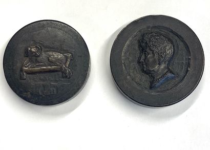 null Two circular medallions in bronze with brown patina decorated in low relief...