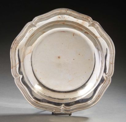 null Hollow silver dish, the edge scalloped and molded with nets, the wing monogrammed....