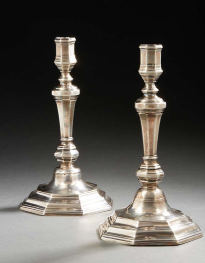 null Pair of cast silver torches, the octagonal foot, the shaft, the collars and...