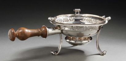 null Silver table stove resting on three scrolls, the body is worked with the repercé...