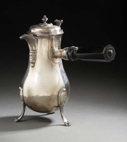null Silver tripod chocolate pot, the spout decorated with a stylized shell. Side...