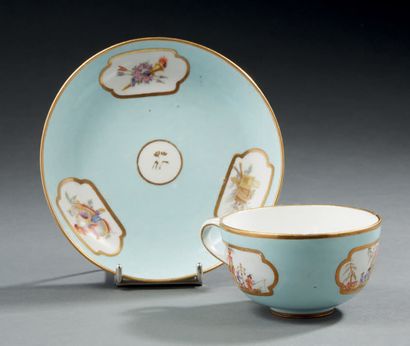 SÈVRES Tea cup and its under cup in hard porcelain with blue lavender bottom decorated...