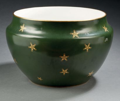 SÈVRES Circular porcelain pot cover with a green-bronze monochrome background decorated...