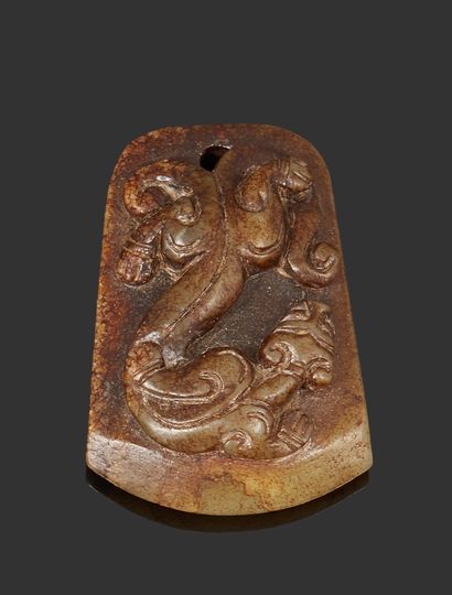 null CHINA

Brown nephrite pendant in the form of a tablet decorated with a kilin....