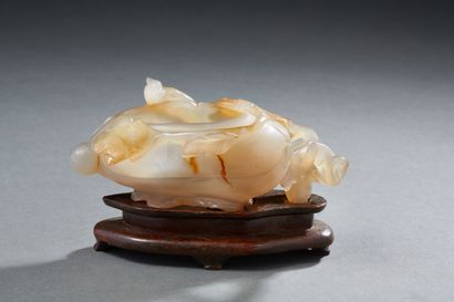 null Carved agate water jug representing a ribbed fruit (squash) with birds on the...