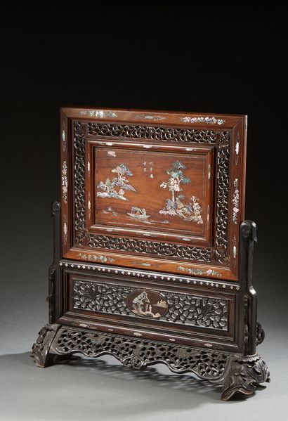 null CHINA

A two-part scholar's screen, in openwork carved wood inlaid with mother-of-pearl...