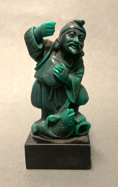 null Subject representing in green hard stone a fisherman on a black base.

H.: 9.5...