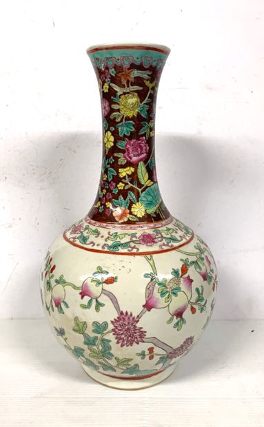 null CHINA

Porcelain vase with a long narrow neck decorated in Famille Rose enamels...