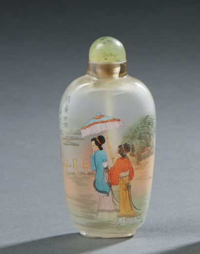 null CHINA

Glass snuff bottle painted inside with scenes of women in landscapes...