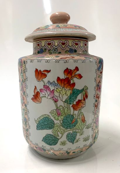 null Porcelain covered vase decorated in enamels of the pink family with flowers.

H....
