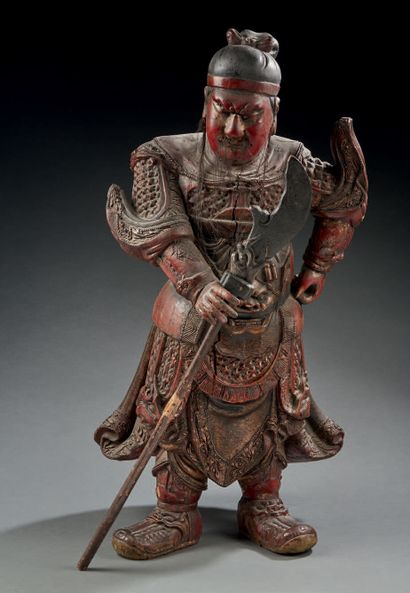 CHINE Large carved wooden figurine in brown and red lacquer representing a temple...
