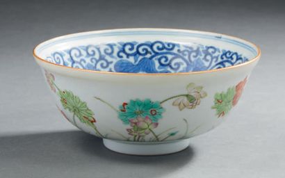 CHINE Circular porcelain bowl decorated in blue underglaze on the inside with lotus...