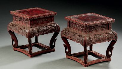 CHINE Pair of small saddles with four legs joined by a spacer in red lacquered wood...