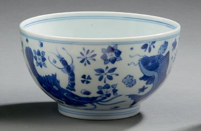 CHINE Circular porcelain bowl decorated in blue underglaze with fish and shellfish...
