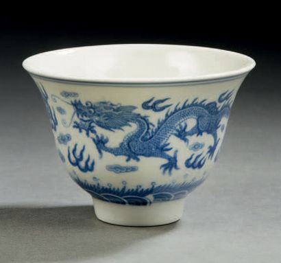 CHINE Circular porcelain bowl decorated in blue underglaze with two dragons with...