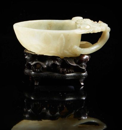 CHINE A light green jade scholar's object representing a water bucket in the shape...