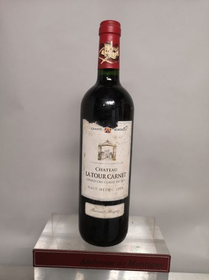 null 1 bottle Château LA TOUR CARNET - 4th GCC Haut Médoc 2004 

Label slightly stained...
