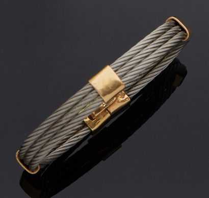 FRED BRACELET in yellow gold 750 mm and three steel cables.
Length : 17 cm
Gross...
