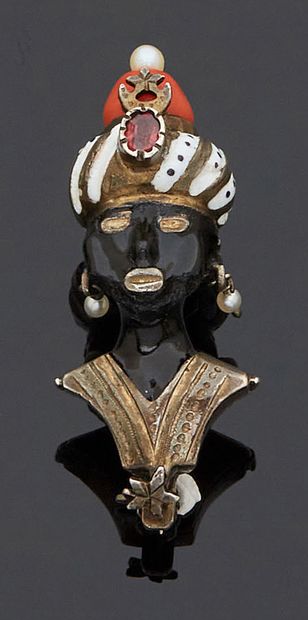 null GOLDEN BRUSH presenting a bust of a Moor in costume, the headdress enamelled...