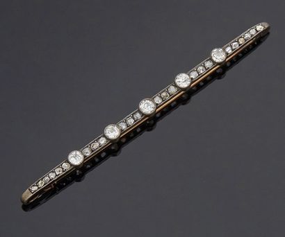 null Gold and silver barrette brooch set with 5 old cut diamonds weighing approximately...