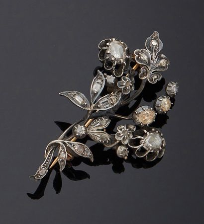 null * A gold and silver flowering branch brooch, entirely set with rose-cut diamonds...