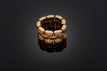 CHAUMET, Paris Articulated ring in yellow gold 750 mm with three rows of links, two...