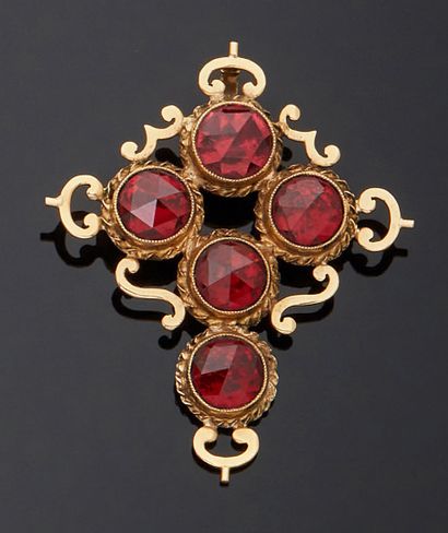null Pendant cross in yellow gold 750 mm decorated with round faceted garnets mounted...